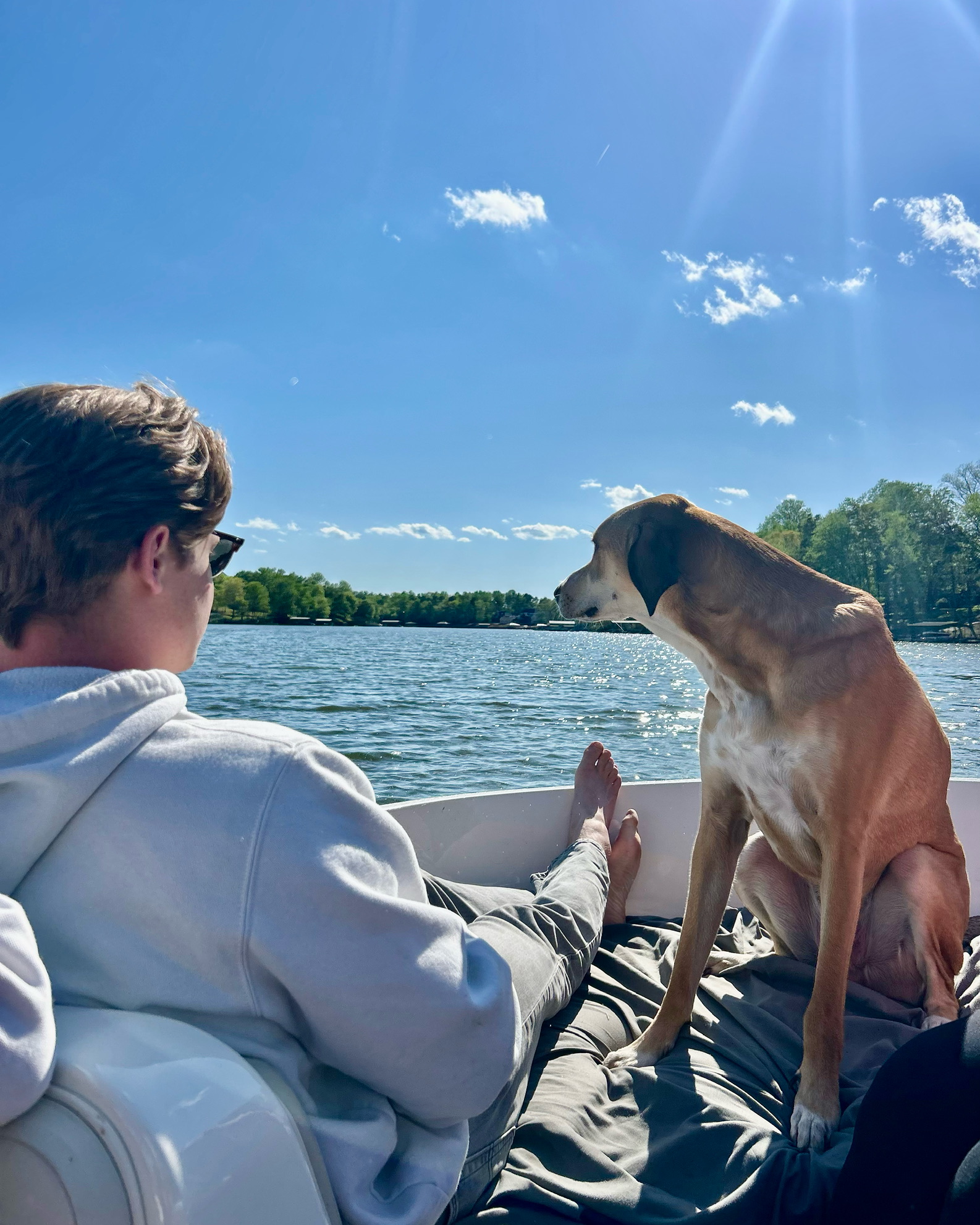 Hunter enjoying time on the water with a dog